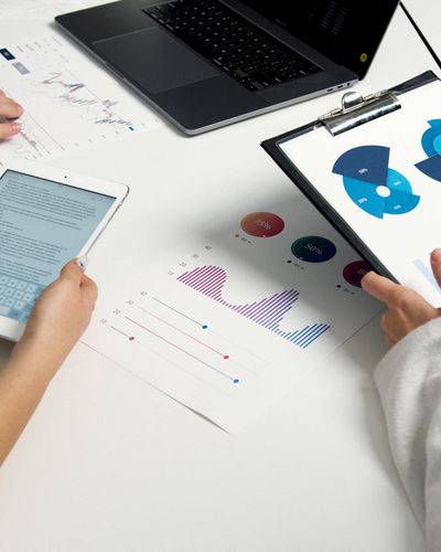 Business team analyzing investment portfolio performance and strategic capital allocation