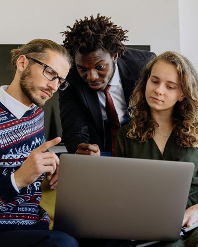 Collaborative financial strategy planning session with diverse team members