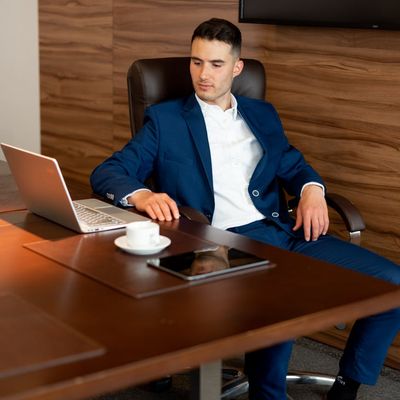 Confident male business executive in contemporary corporate environment