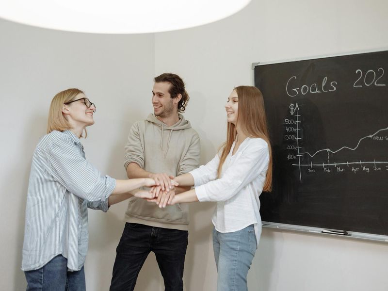 Professional financial consulting team celebrating business success together